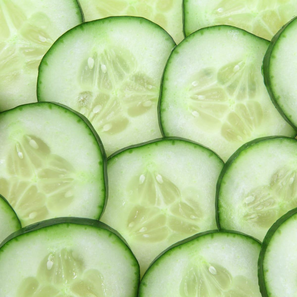 A close-up of overlapping fresh cucumber slices