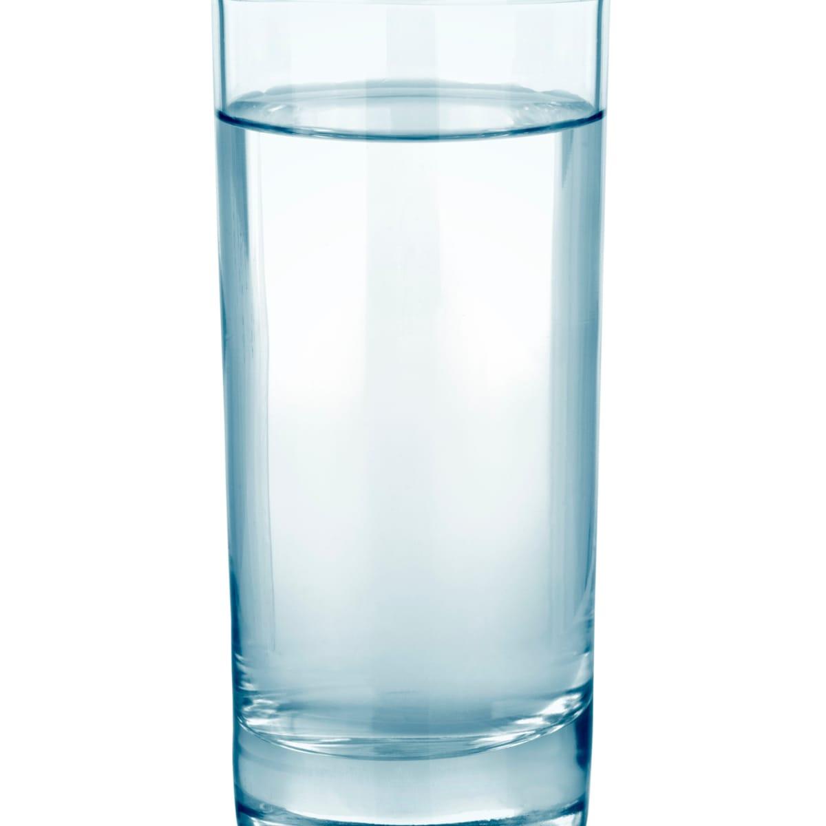 A tall glass of water on a white background