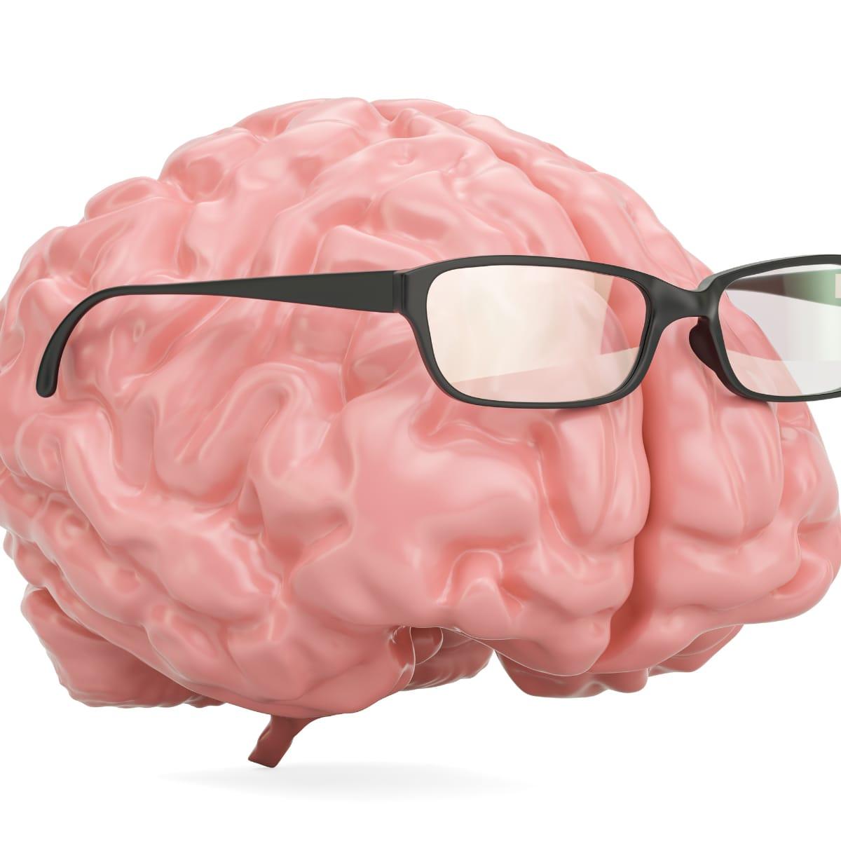 An illustration of a pink human brain wearing black reading glasses