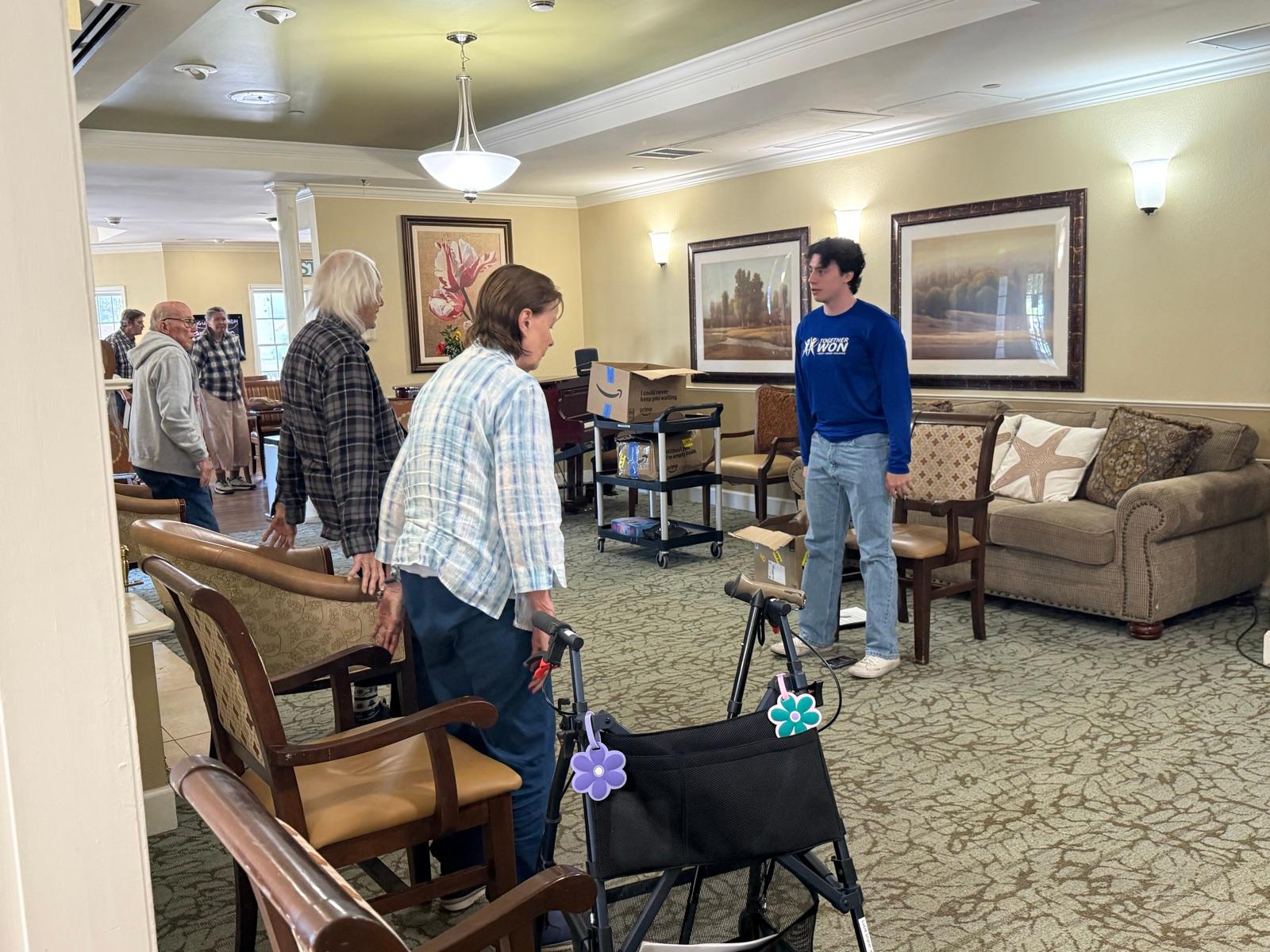 TogetherWON trainer Alex leading a group exercise class for residents of a senior living community